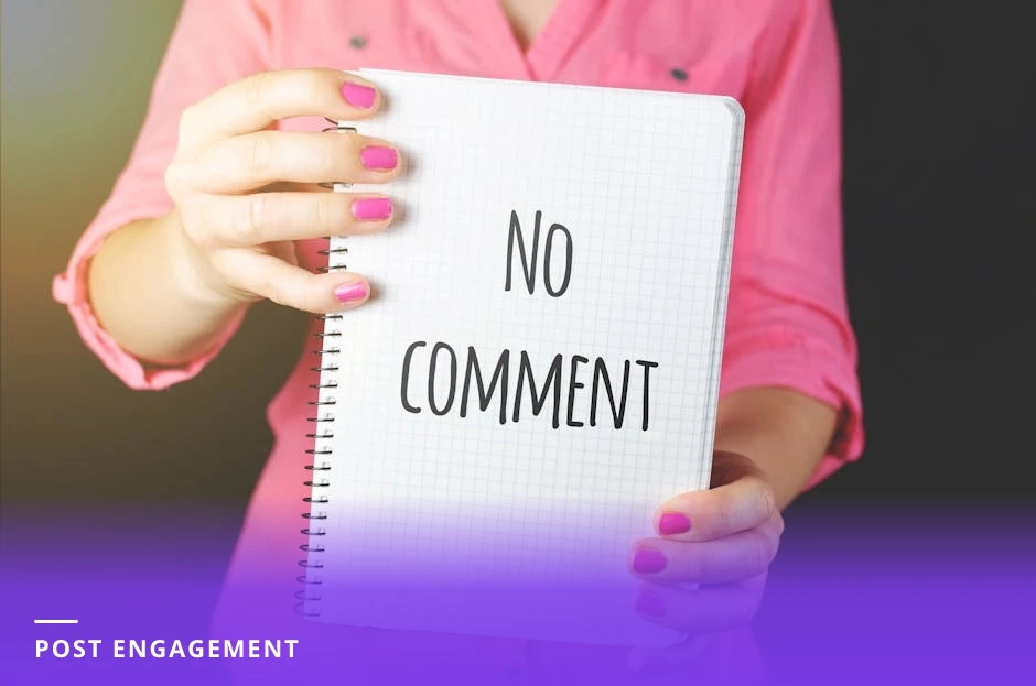 Career coach at a sunlit modern Western office desk, leaning forward typing a reply to comments on a laptop with a smartphone and notebook beside them