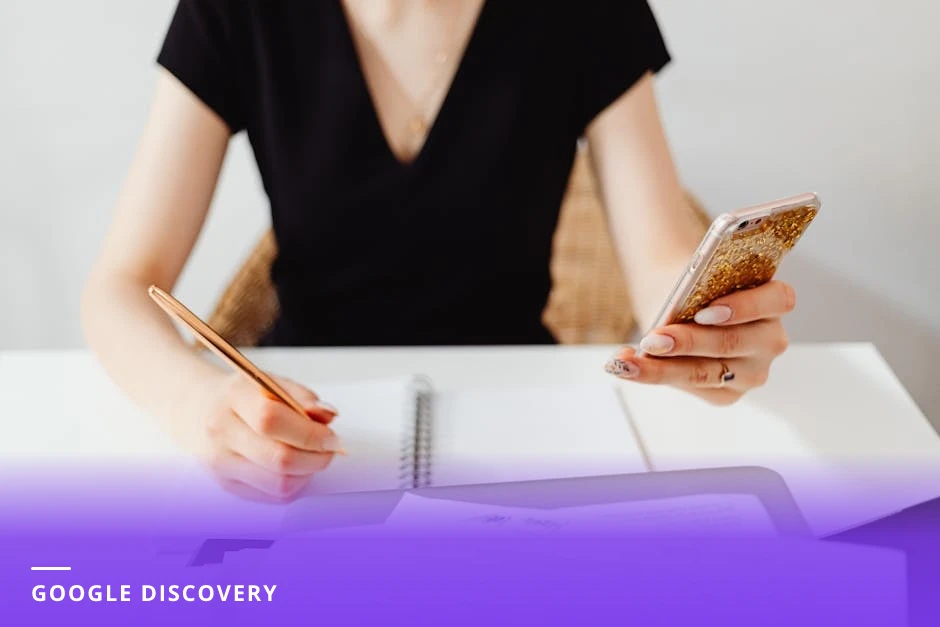Close-up of hands holding a smartphone in a cafe, screen visible showing Google search results for 'career coach Amsterdam', blurred cafe background