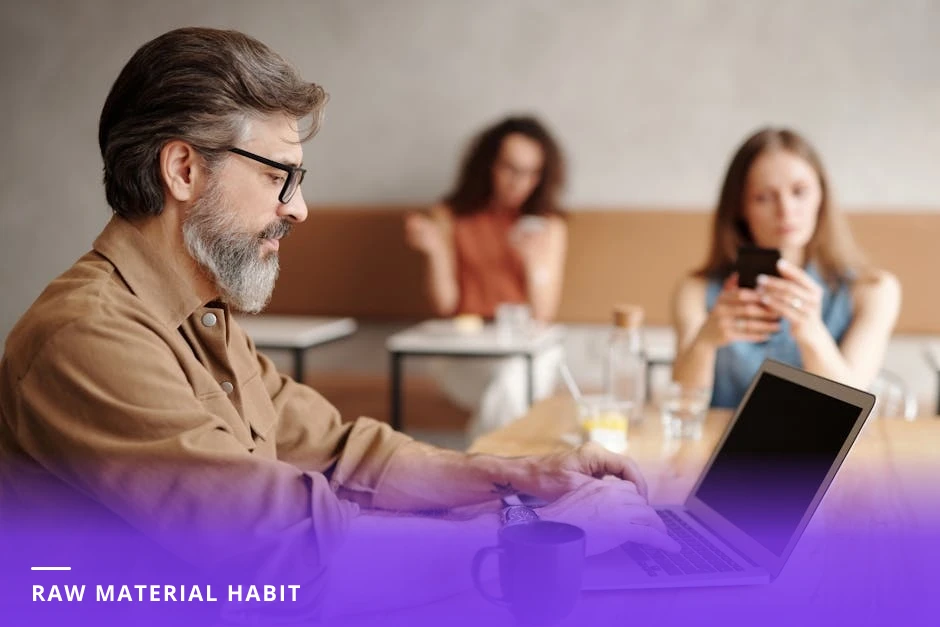 Diverse coach sitting at a sunlit café table, typing brief notes into a smartphone with a coffee cup beside them